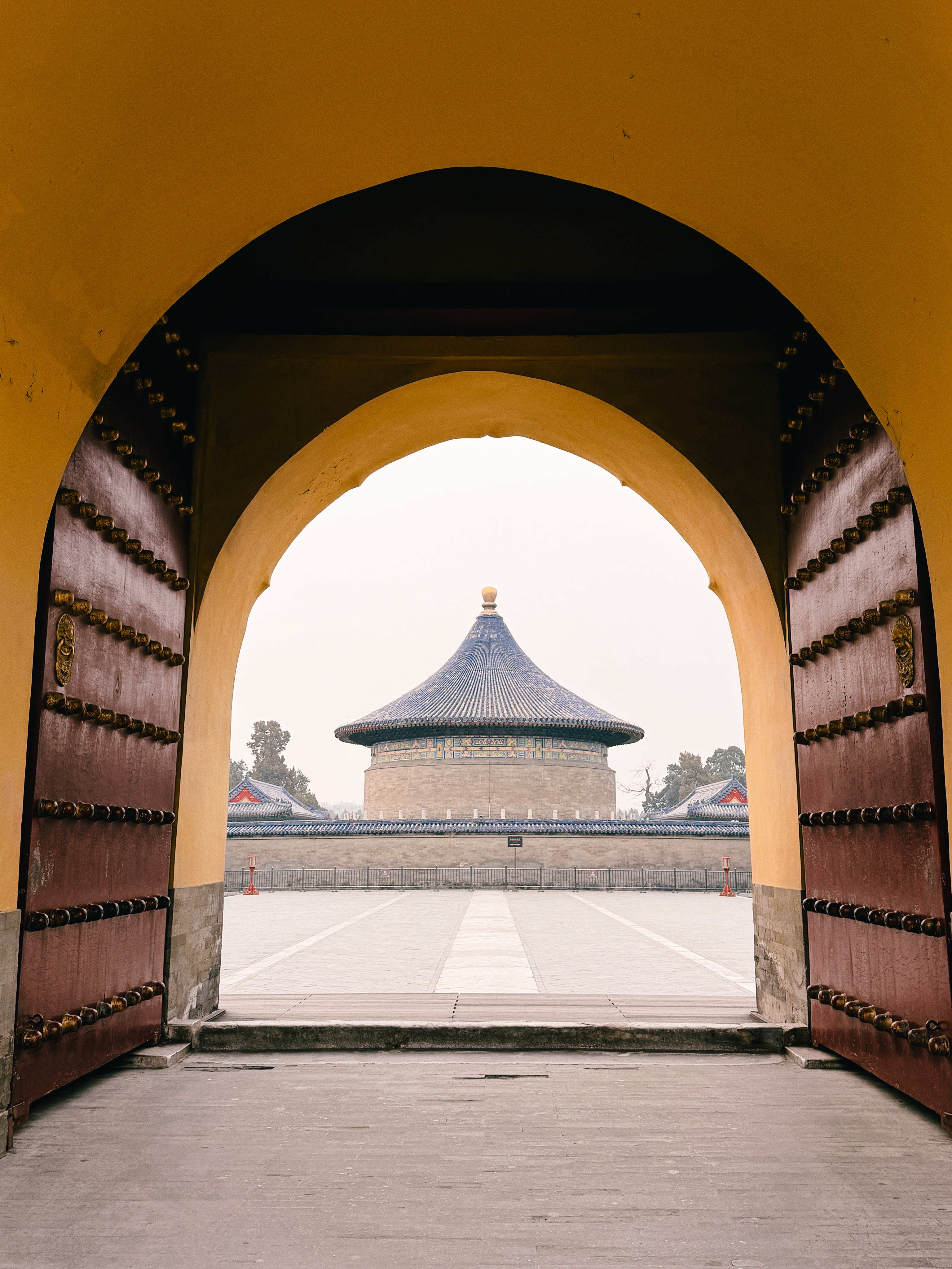 Temple of Heaven framed by a traditional gate in Beijing