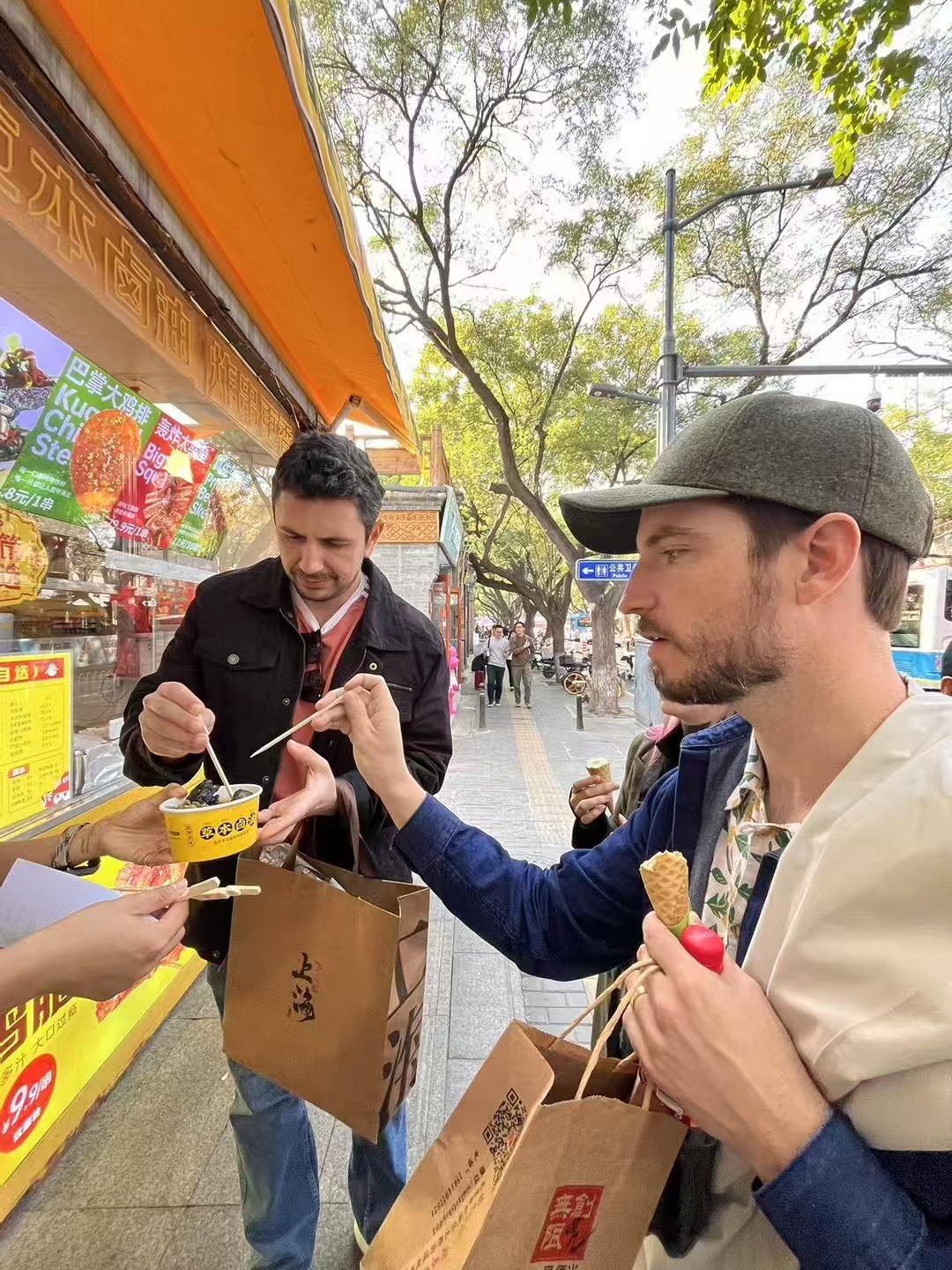 International guests trying street-side local food during a first China visit