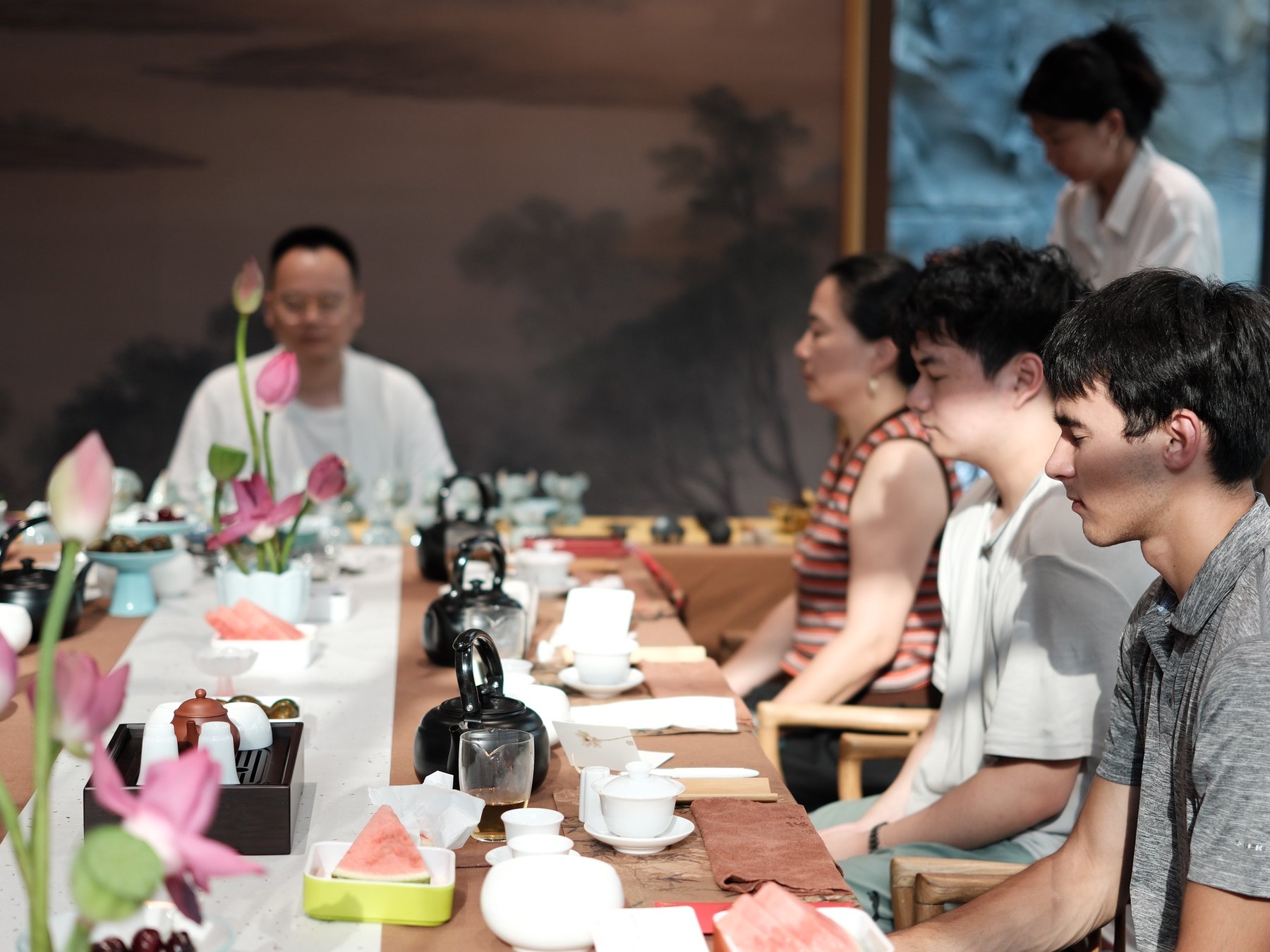 Guests seated around a table during a private Chinese tea experience