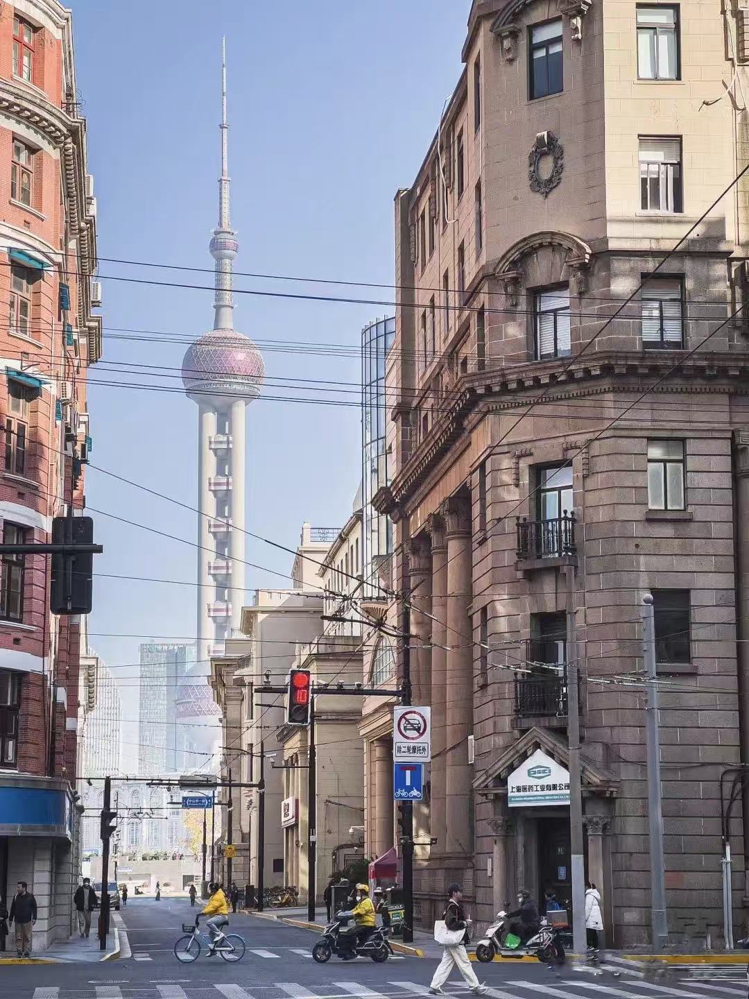 Historic Shanghai architecture with the Oriental Pearl Tower in the background